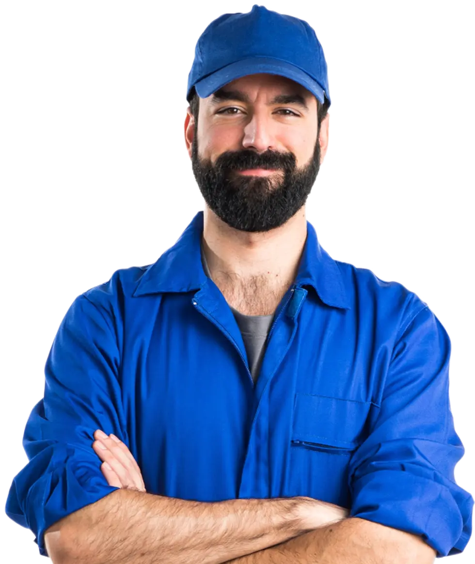 Friendly worker in a blue uniform and cap with crossed arms, showcasing confidence and professionalism.